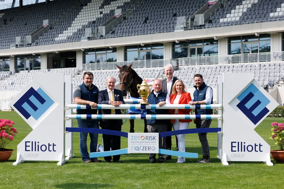 Elliott Group team with horse and Dublin Horse Show trophy